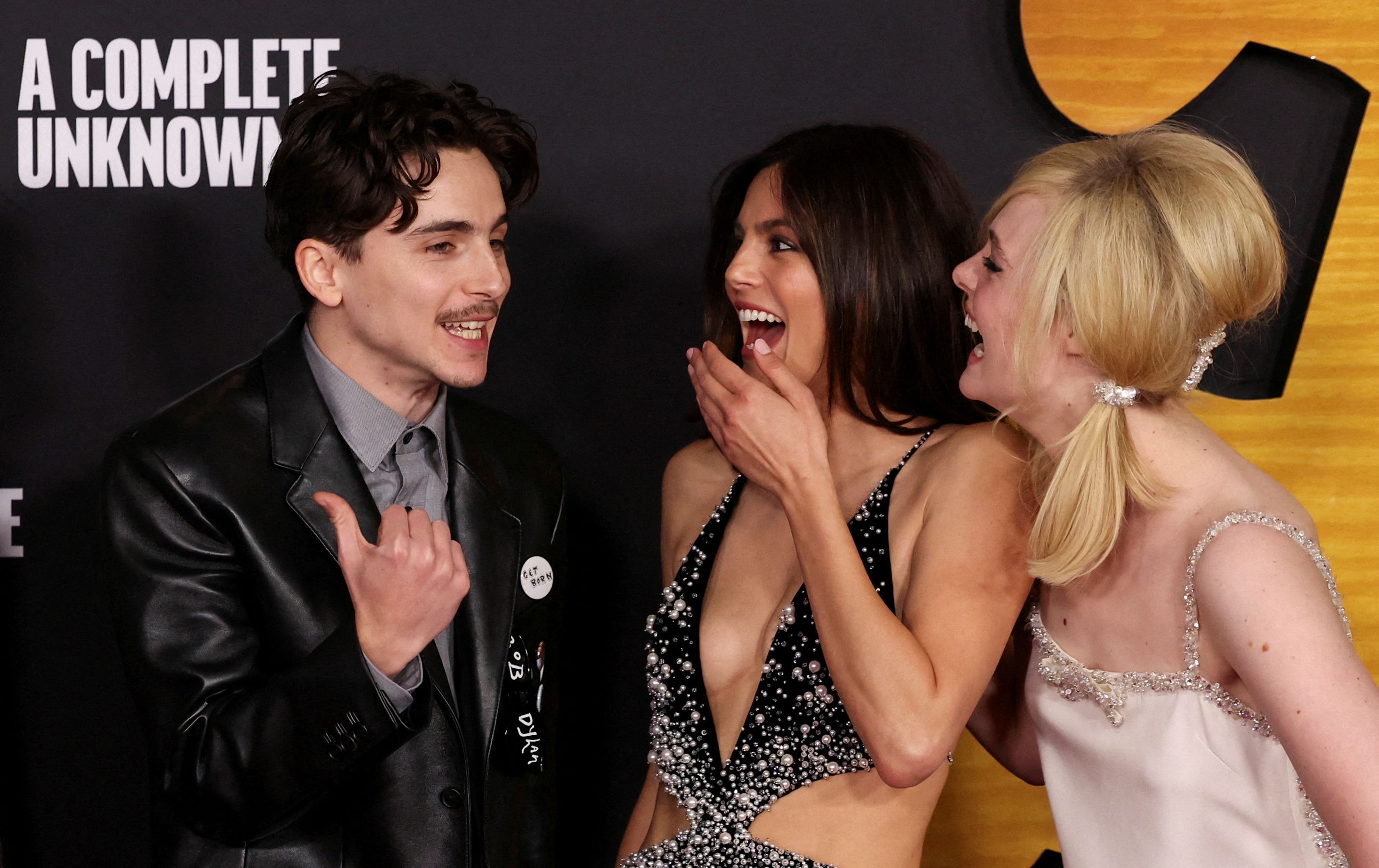 Timothee Chalamet, Monica Barbaro and Elle Fanning attend a premiere of the film "A Complete Unknown" at Dolby Theatre in Los Angeles, California, December 10, 2024. Credit: Reuters File Photo