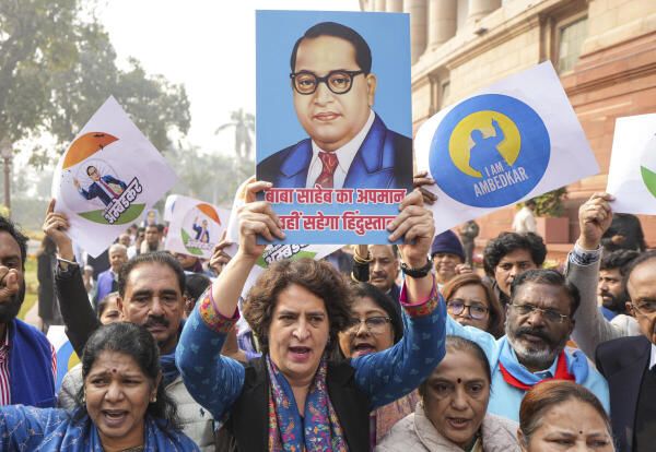 Congress MP Priyanka Gandhi Vadra and other I.N.D.I.A. bloc MPs during their protest against Home Minister Amit Shah over his remarks related to B R Ambedkar. Credit: PTI Photo