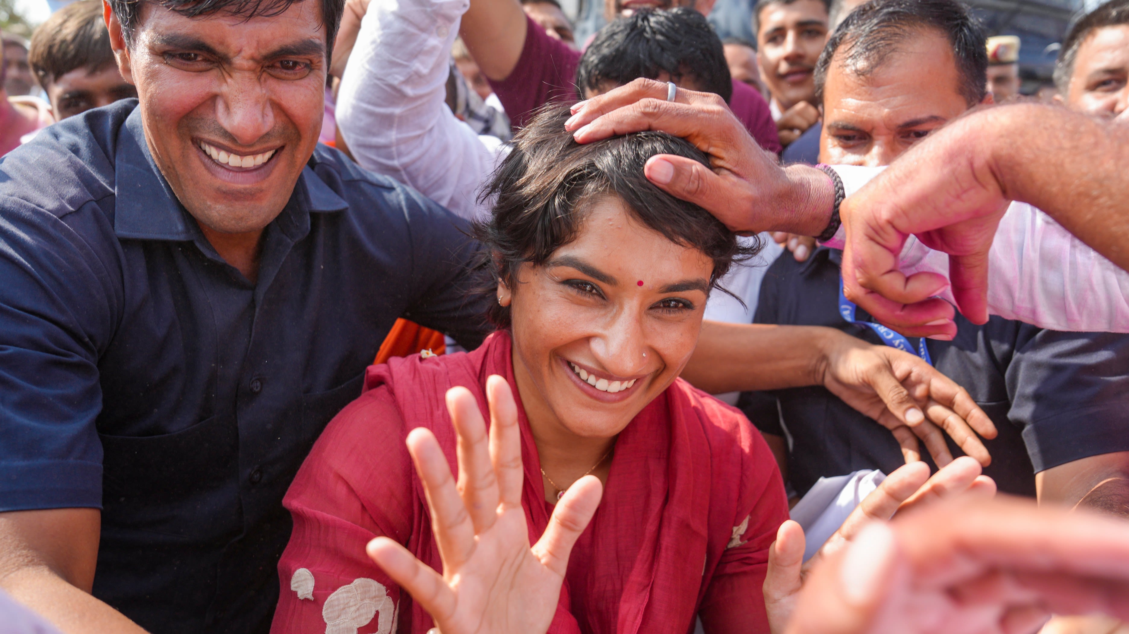 Vinesh Phogat celebrates with supporters after her victory from the Julana constituency in the Haryana Assembly elections. Credit: PTI File Photo
