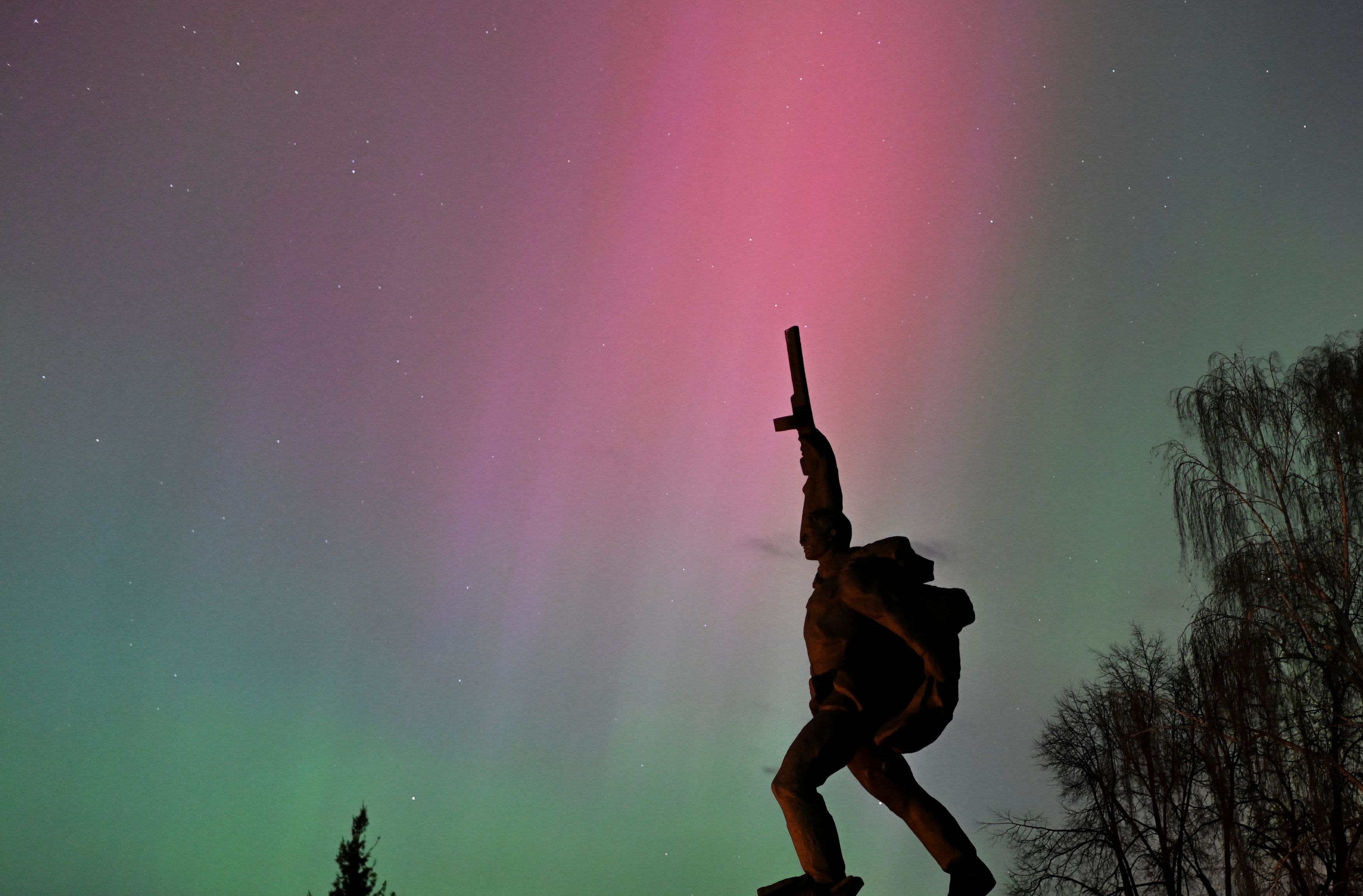 The aurora borealis, also known as the 'northern lights’, caused by a coronal mass ejection on the Sun, illuminate the skies over the WWII monument in the southwestern Siberian town of Tara, Omsk region, Russia May 11, 2024. Credit: Reuters Photo